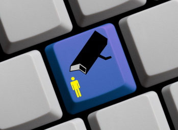 A conceptual computer keyboard with a single key featuring an icon of a surveillance camera pointing towards a human figure, illustrating the theme of counter-surveillance and the importance of personal privacy in the digital age.